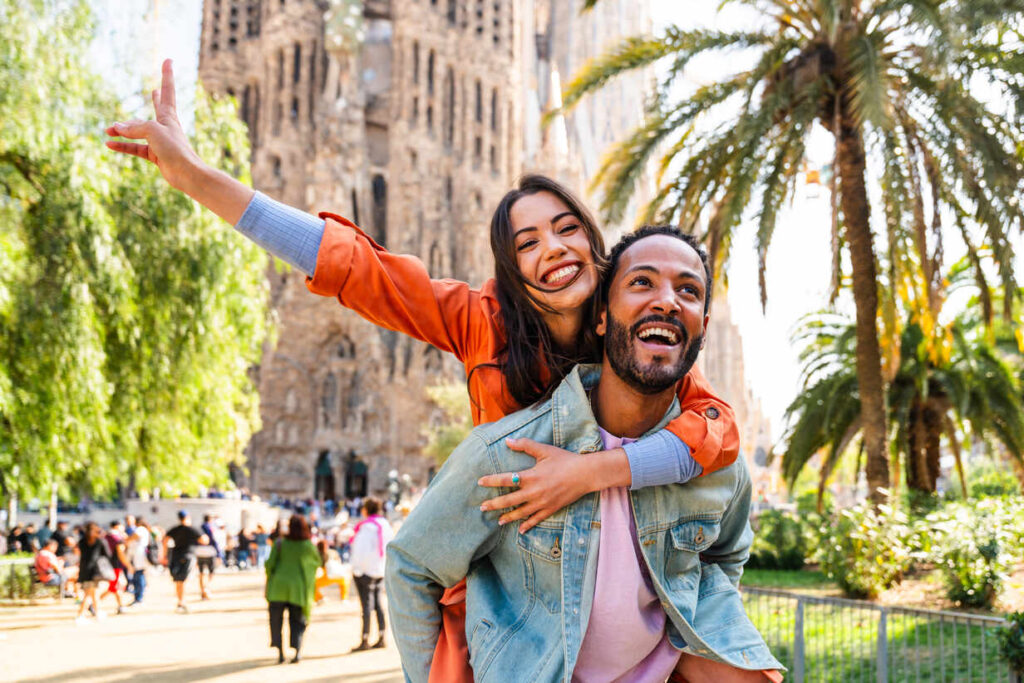 German Opportunity Card multiracial beautiful happy couple of lovers dating at sagrada familia, barcelona multiethnic tourists travelling in europe and visiting a city in spain, concepts about tourism and people lifestyle